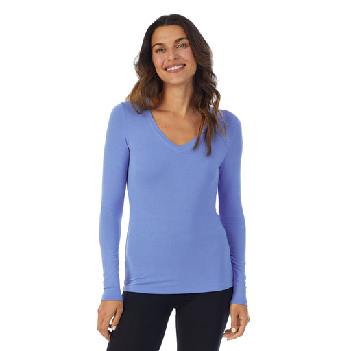 Ultramarine; Model is wearing size S. She is 5’9”, Bust 34”, Waist 25.5”, Hips 36.5”.@A lady wearing ultramarine long sleeve v-neck softwer with stretch top.