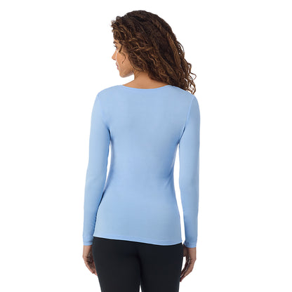 Vista Blue; Model is wearing size S. She is 5’9”, Bust 34”, Waist 23”, Hips 35”.@A lady wearing vista blue long sleeve  softwear with stretch v-neck.