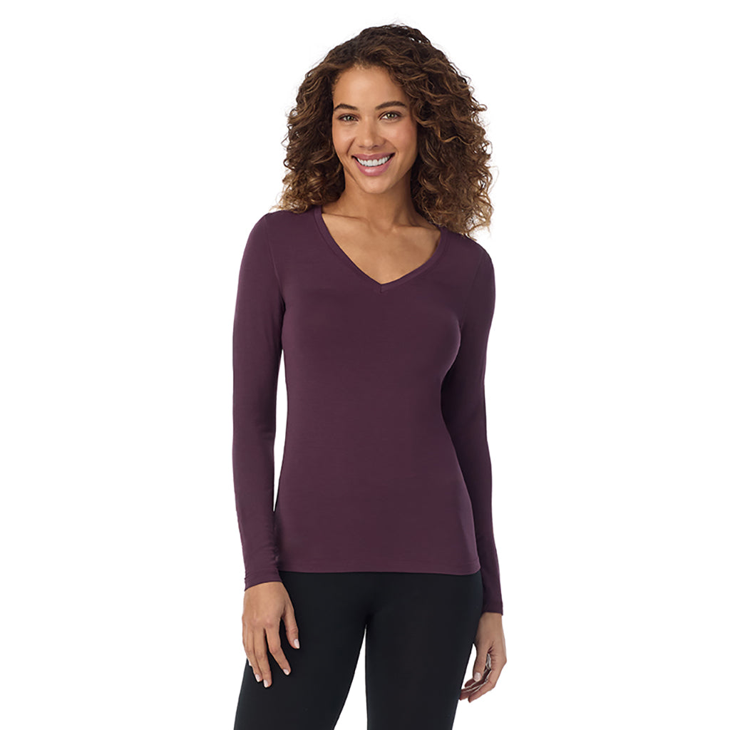 Boysenberry; Model is wearing size S. She is 5’9”, Bust 34”, Waist 23”, Hips 35”.@A lady wearing boysenberrye long sleeve  softwear with stretch v-neck.