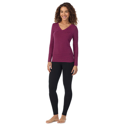 Fuchsia Stripe; Model is wearing size S. She is 5’9”, Bust 34”, Waist 23”, Hips 35”.@A lady wearing fuchsia stripe long sleeve  softwear with stretch v-neck.