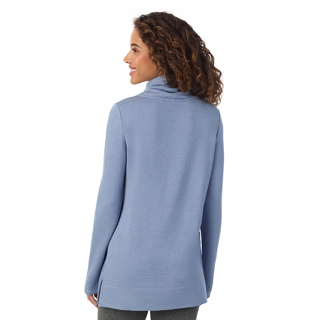 Smoke Blue Heather; Model is wearing size S. She is 5’9”, Bust 34”, Waist 23”, Hips 35”@ A Lady is wearing a Smoke Blue Heather Ultra Cozy Long Sleeve Cowl Neck Tunic