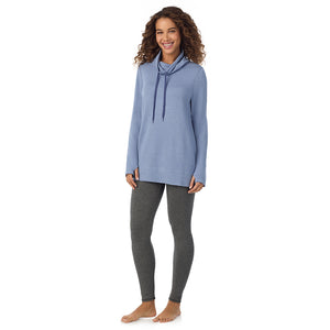  A Lady is wearing a Smoke Blue Heather Ultra Cozy Long Sleeve Cowl Neck Tunic