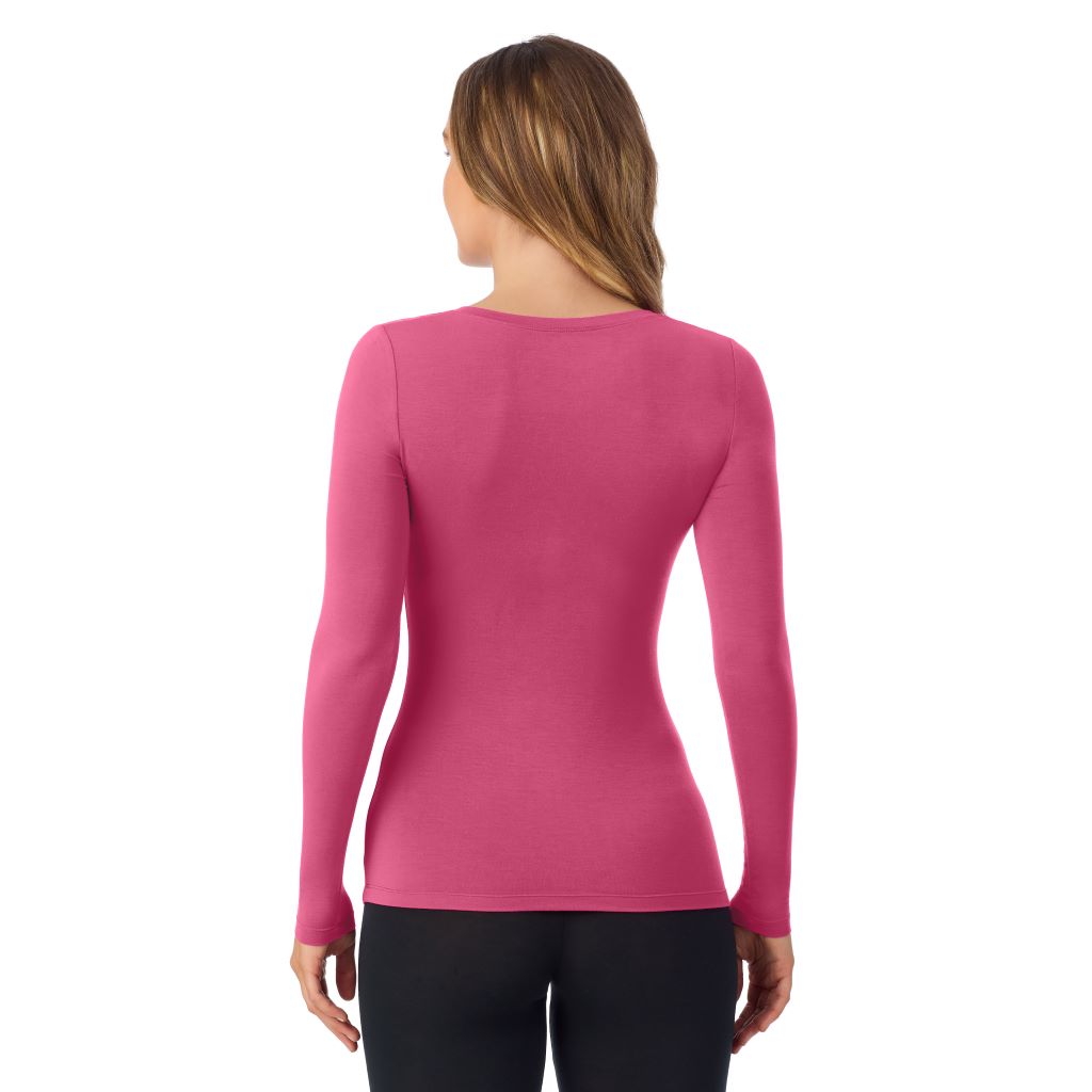 A lady wearing very berry long sleeve  softwear with stretch v-neck.