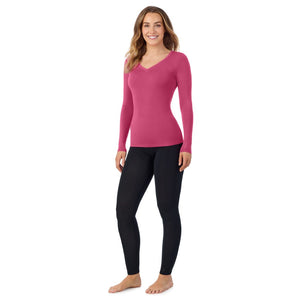 A lady wearing very berry long sleeve v-neck tall softwear with stretch top.