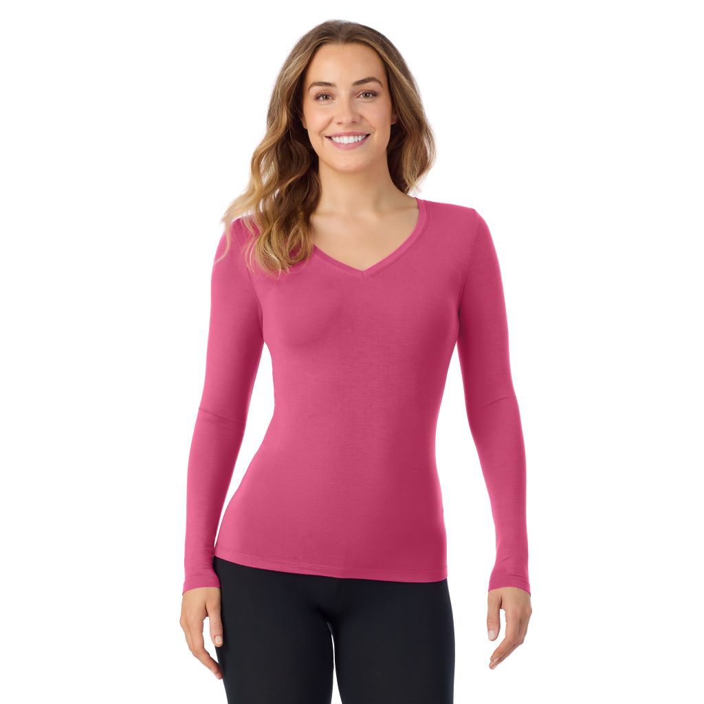A lady wearing very berry long sleeve  softwear with stretch v-neck.