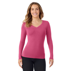A lady wearing very berry long sleeve  softwear with stretch v-neck.