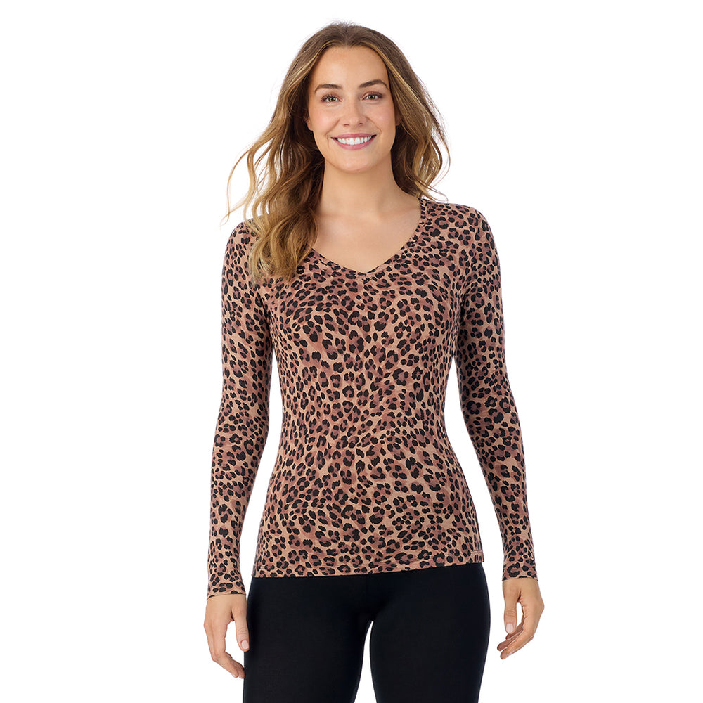 A lady wearing taupe leopard long sleeve  softwear with stretch v-neck.