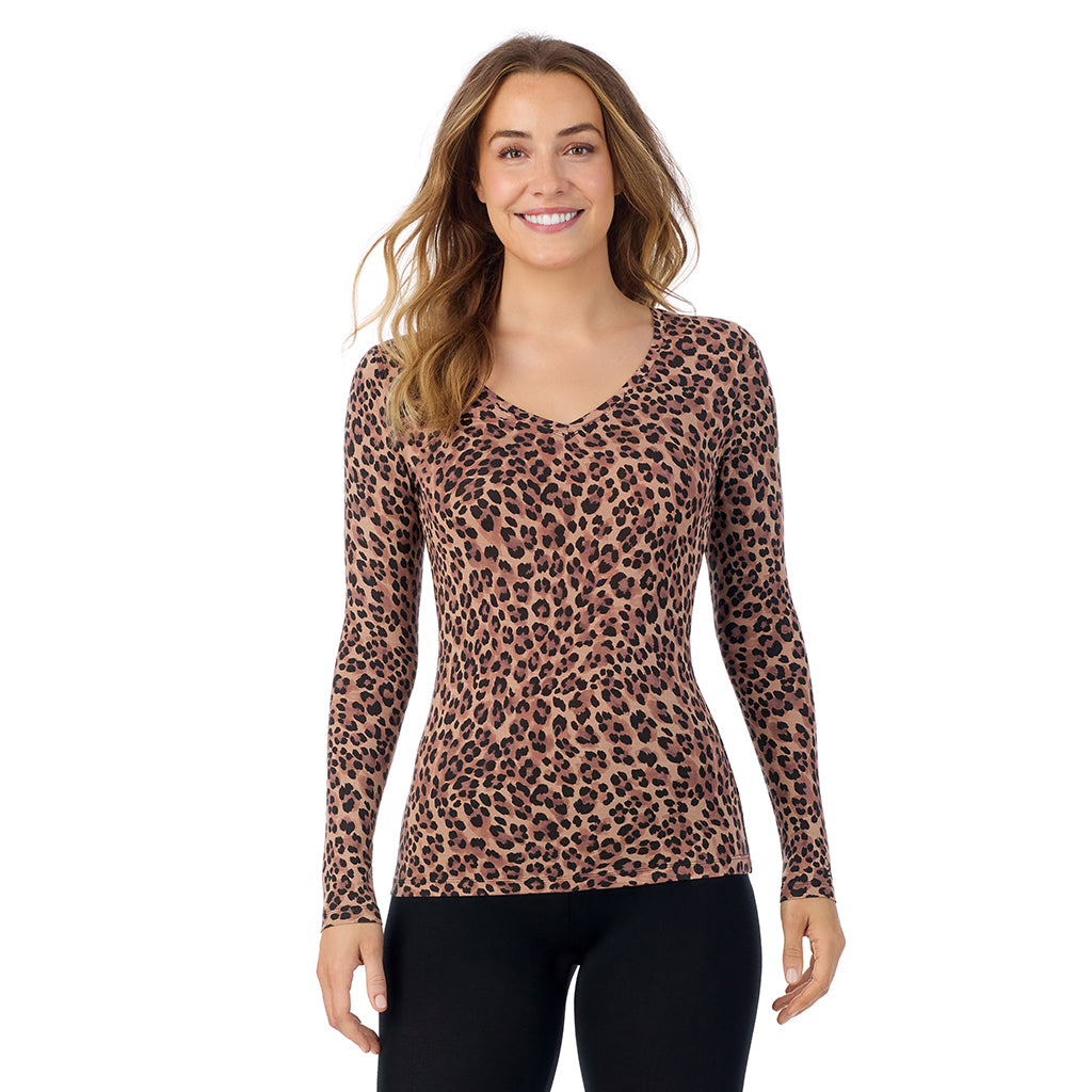 A lady wearing taupe leopard long sleeve  softwear with stretch v-neck.