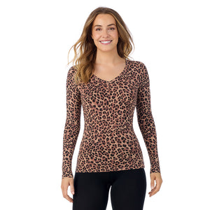 A lady wearing taupe leopard long sleeve  softwear with stretch v-neck.
