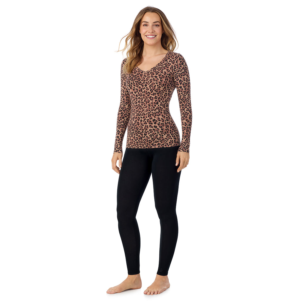 A lady wearing taupe leopard long sleeve  softwear with stretch v-neck.