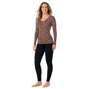 A lady wearing taupe leopard long sleeve  softwear with stretch v-neck.