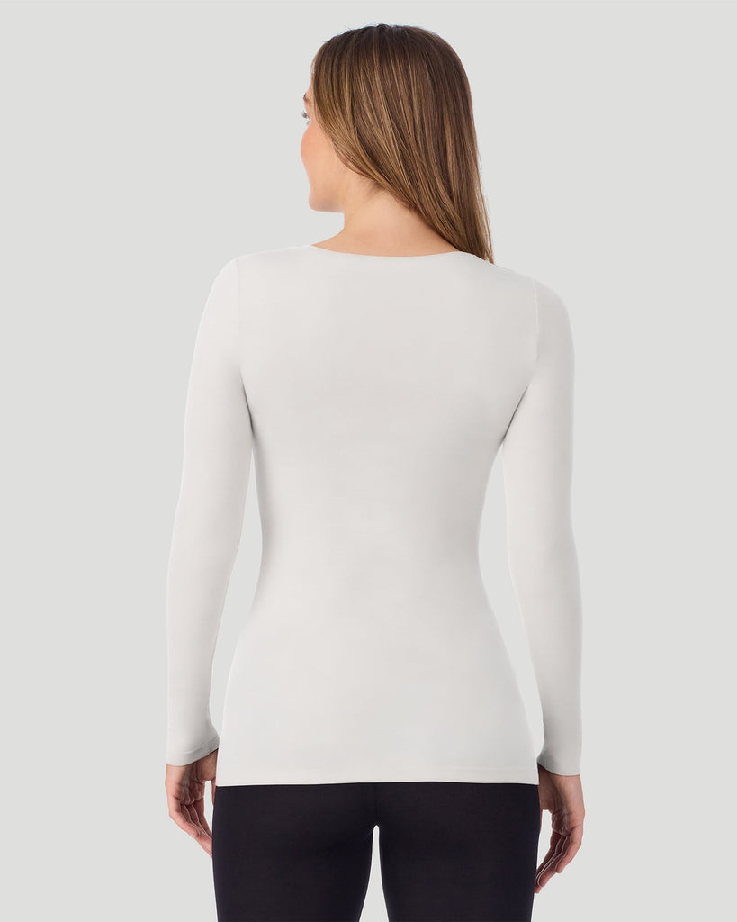 A lady wearing Oatmeal Heather Softwear With Stretch Long Sleeve V-Neck in a back pose