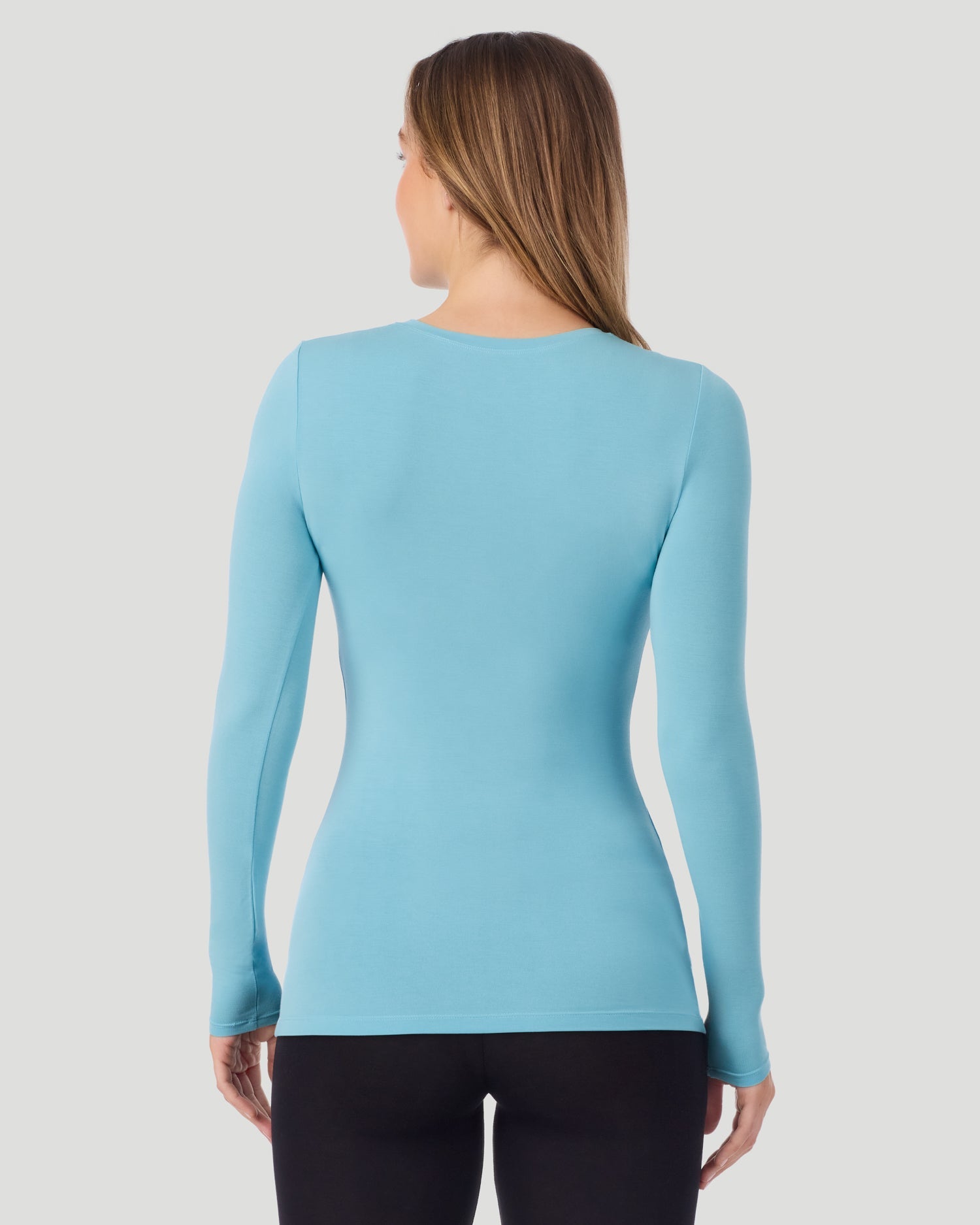 A lady wearing Softwear With Stretch Long Sleeve V-Neck in Cadet Blue