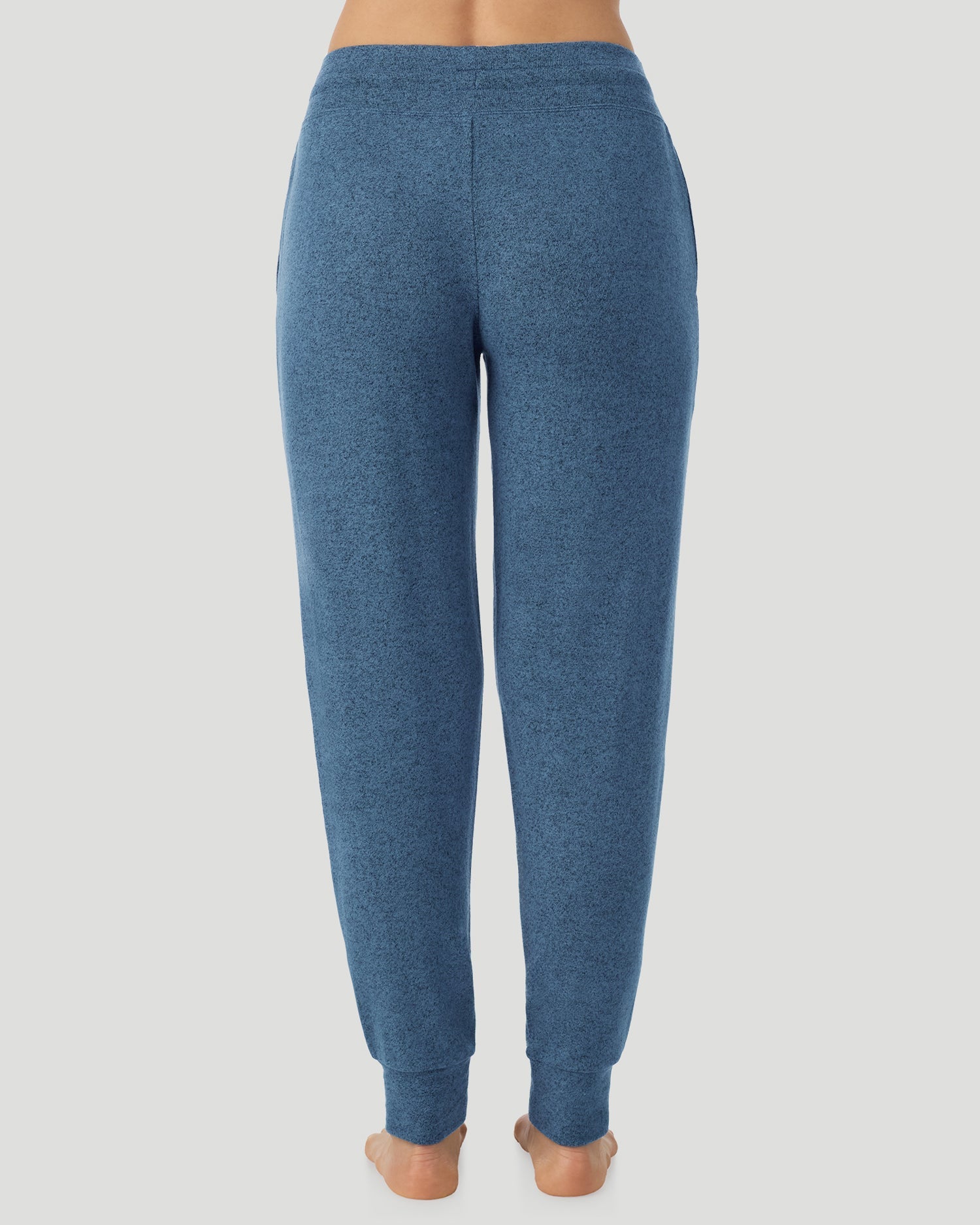  A Lady is wearing Deep Chambray SoftKnit Jogger in a back view look