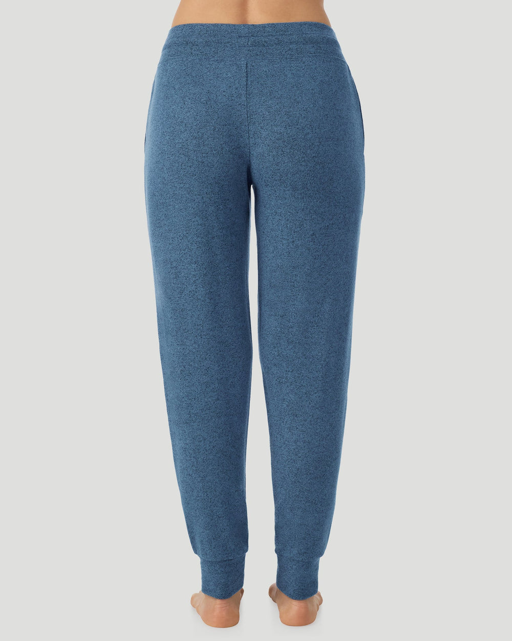 A Lady is wearing Deep Chambray SoftKnit Jogger in a back view look