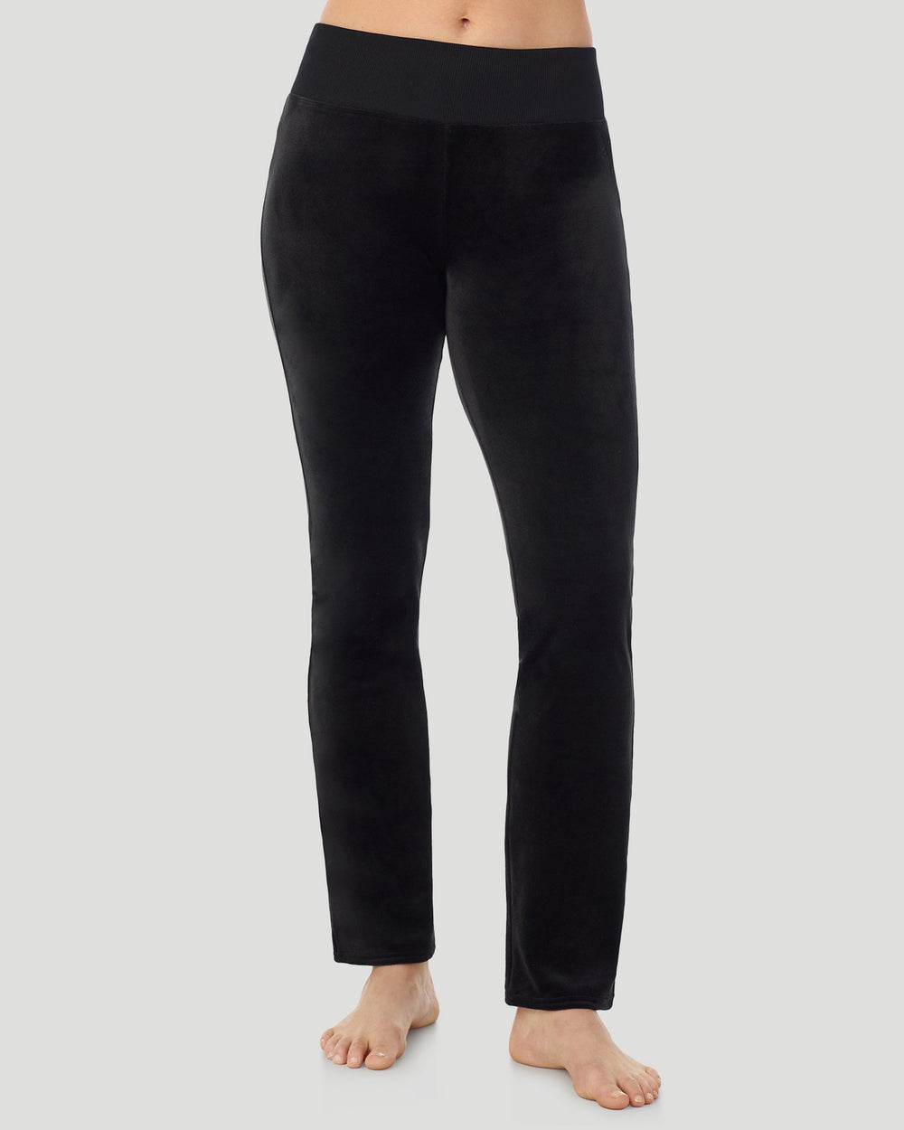 A lady wearing Stretch Velour Boot Cut Legging With Pockets in black shown in a front view pose