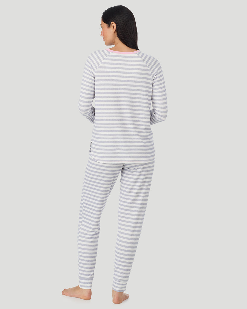  A lady wearing White + Grey Stripe Brushed Sweater Knit Long Sleeve Jogger Pajama Set in a back view pose