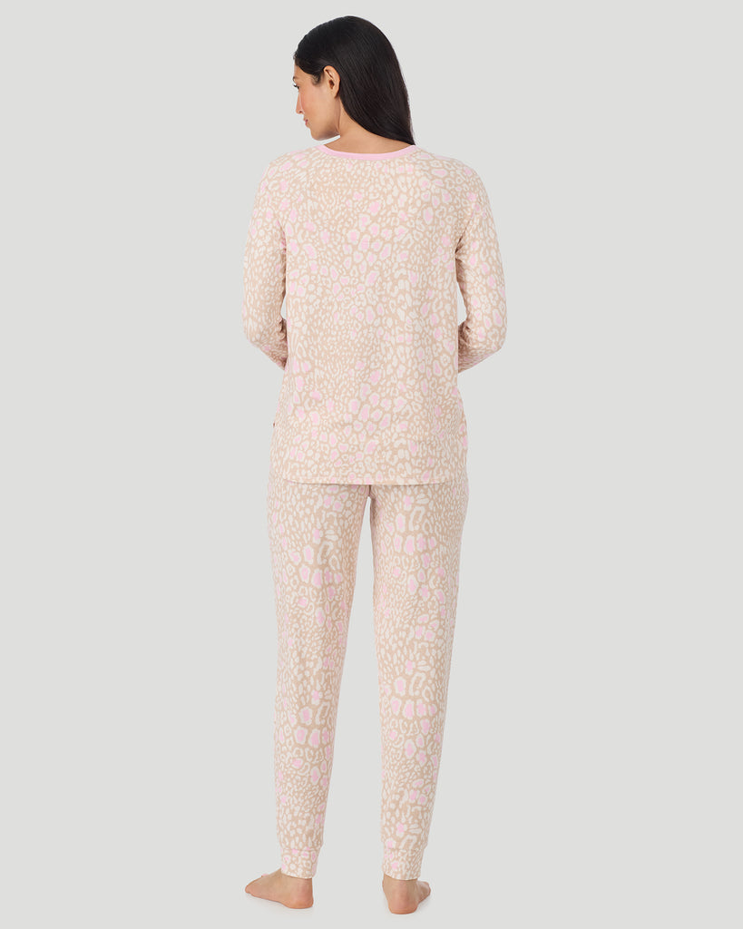  A lady wearing Oatmeal Animal Brushed Sweater Knit Long Sleeve Jogger Pajama Set in a back view pose