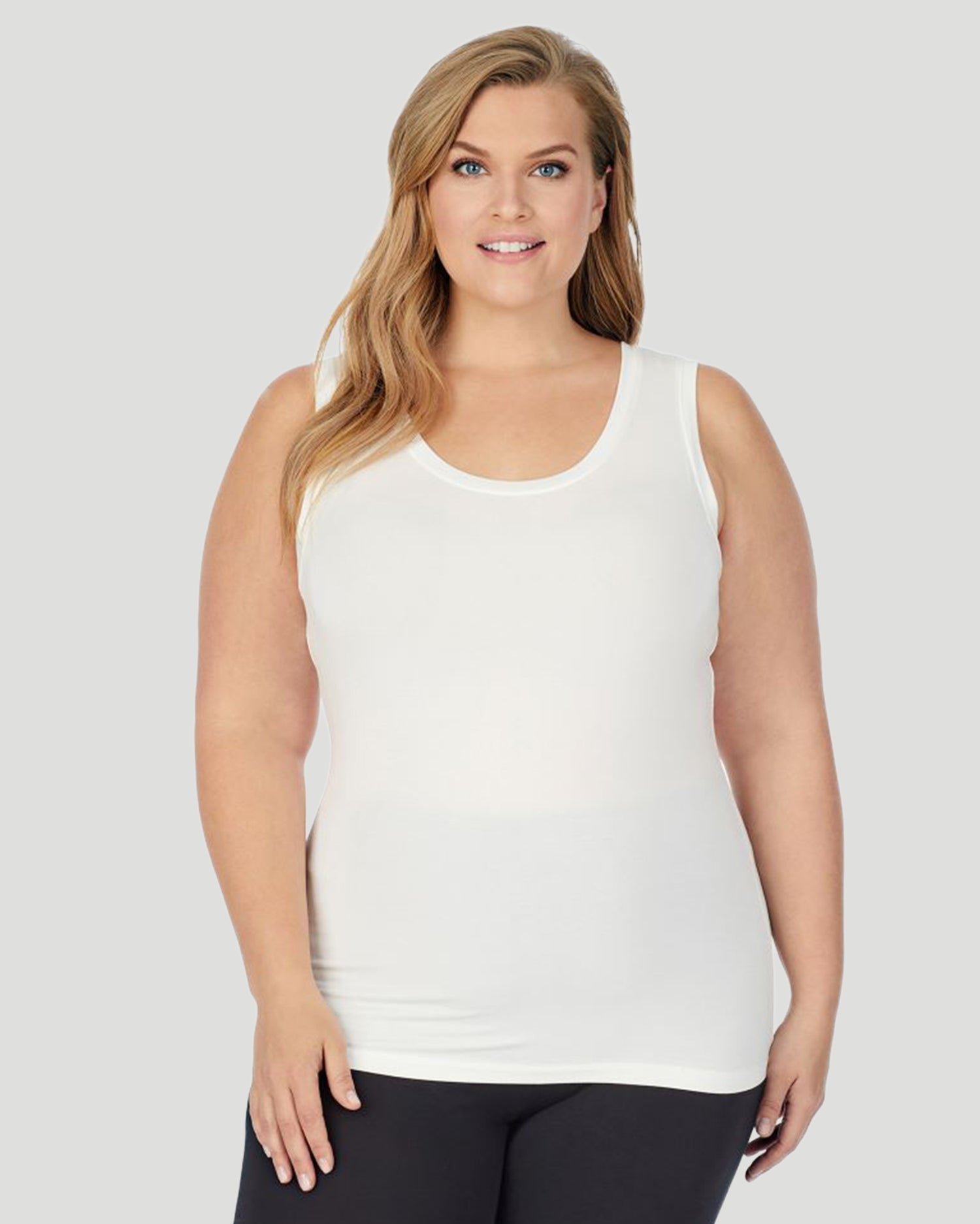A lady wearing Softwear With Stretch Reversible Tank PLUS in Ivory  