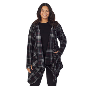 A lady wearing black plaid fleecewear with stretch long sleeve hooded wrap plus.