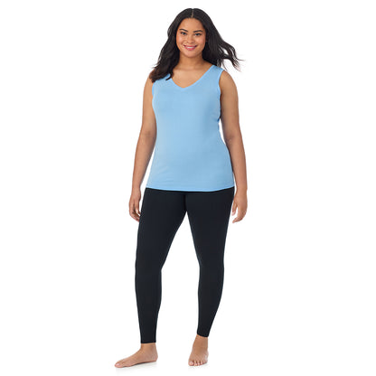 Vista Blue; Model is wearing size 1X. She is 5'11", Bust 36", Waist 36.5", Hips 47.5". @A lady wearing vista blue sleeveless reversible tank plus.