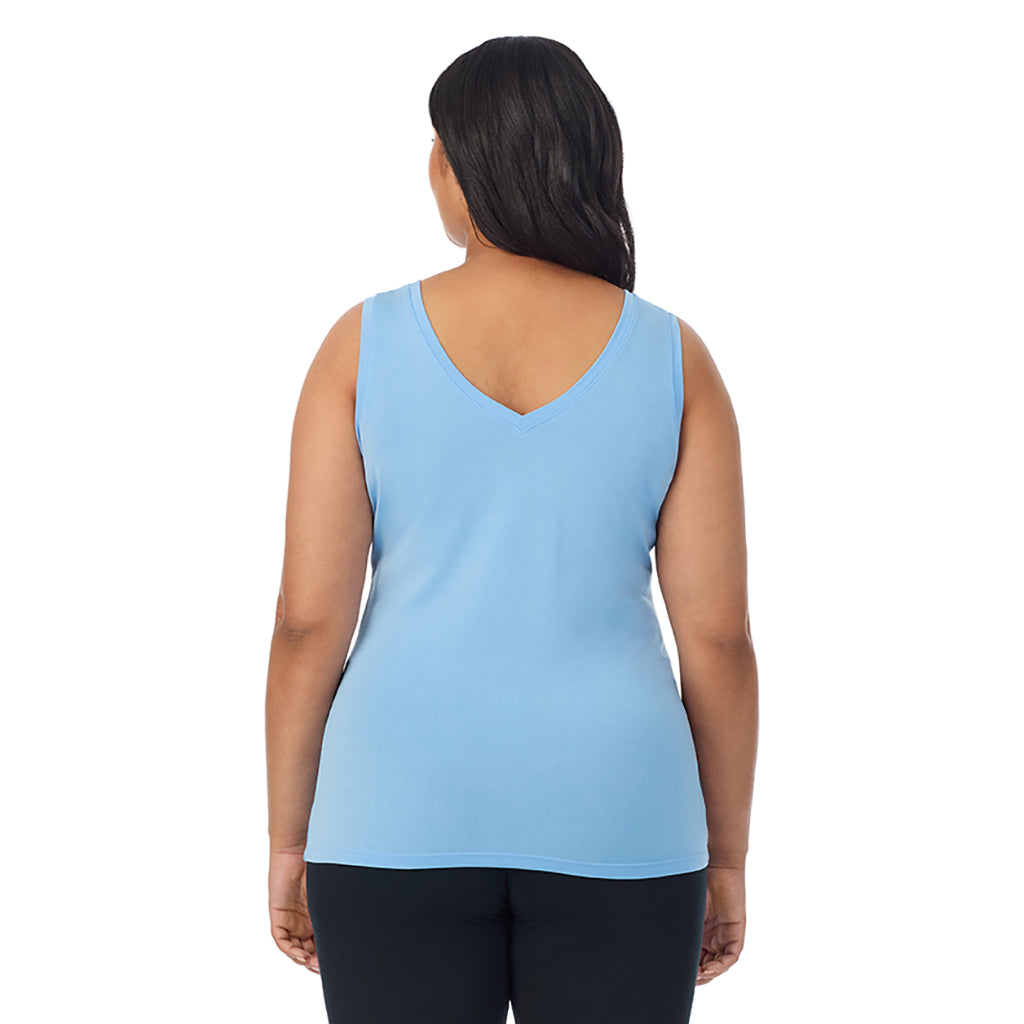 Vista Blue; Model is wearing size 1X. She is 5'11", Bust 36", Waist 36.5", Hips 47.5". @A lady wearing vista blue sleeveless reversible tank plus.