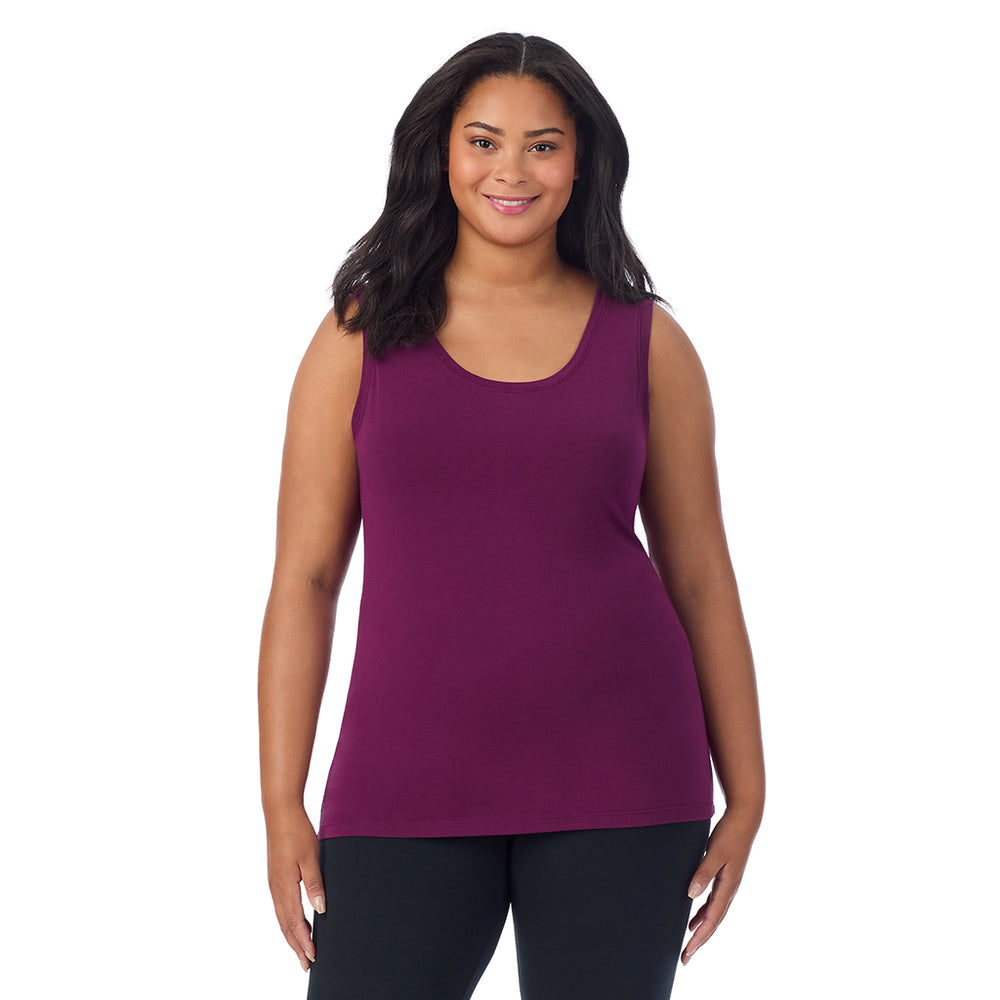 A lady wearing dark purple sleeveless reversible tank plus.