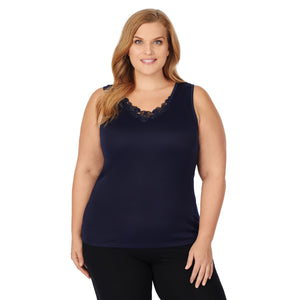 A lady wearing blue softtech venice lace detail cami plus.