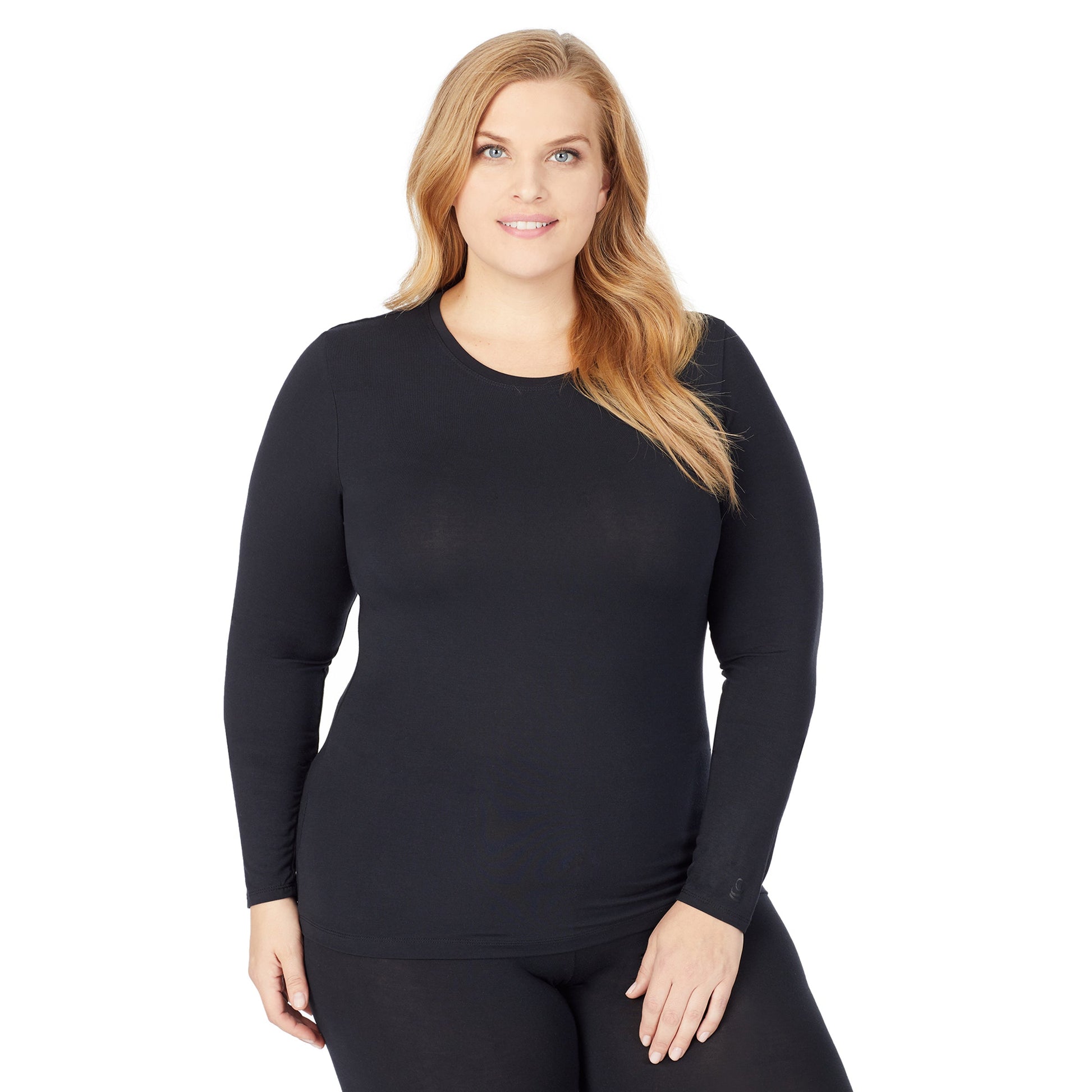 A lady wearing a black long sleeve stretch crew plus.