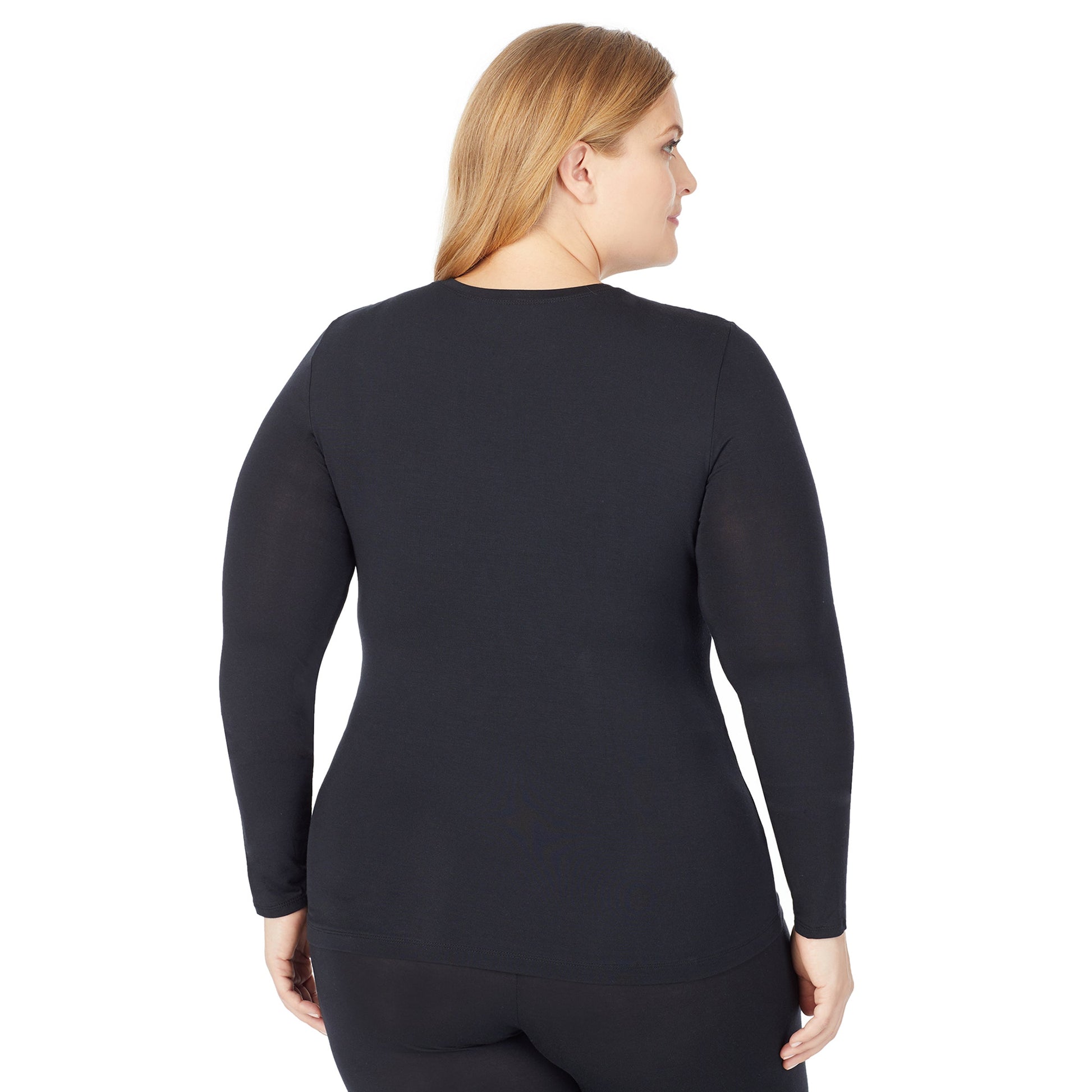 A lady wearing a black long sleeve stretch crew plus.