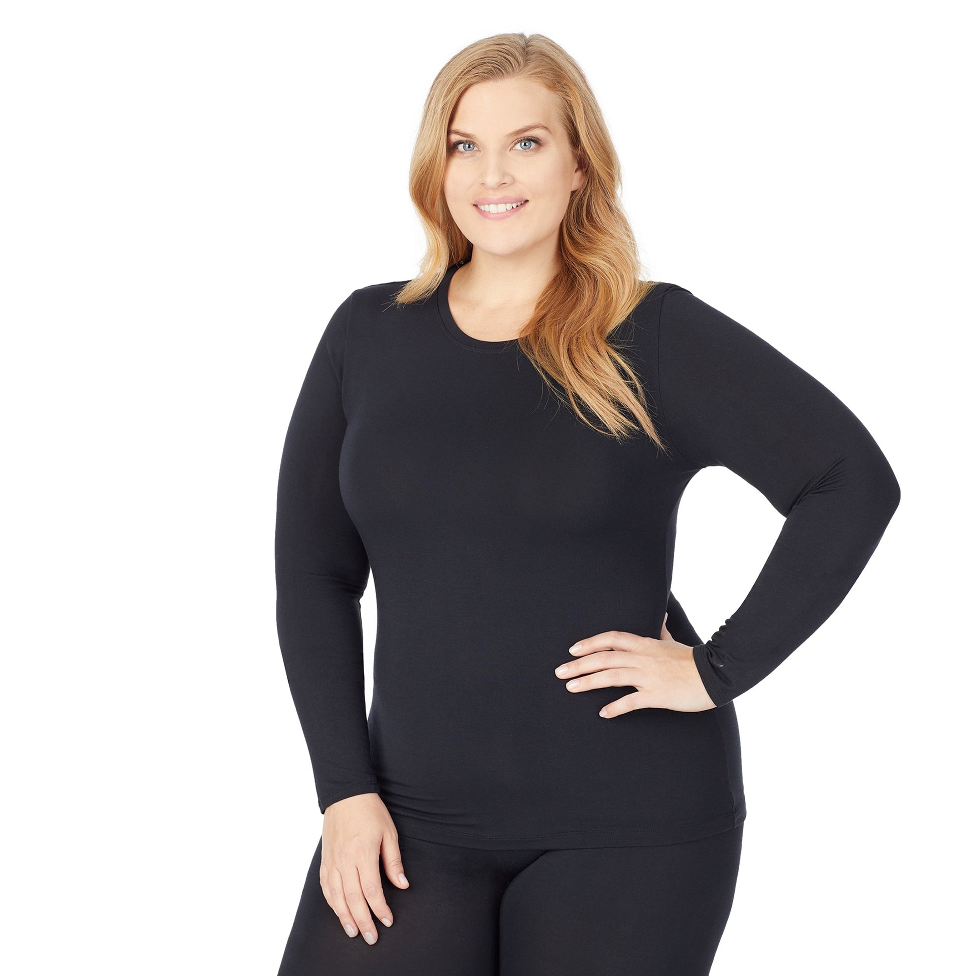 A lady wearing a black long sleeve stretch crew plus.