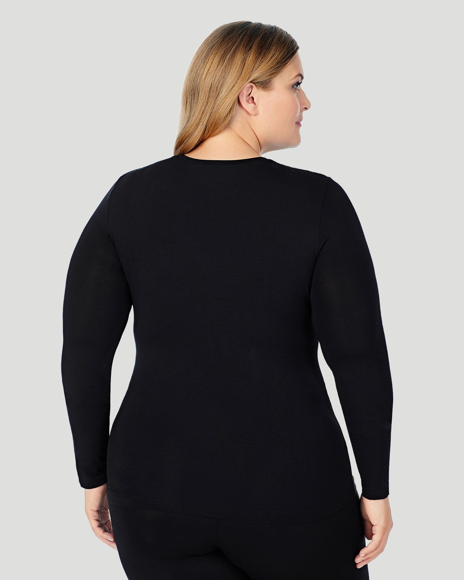 A lady wearing Softwear With Stretch Long Sleeve Crew PLUS in Black back view back view