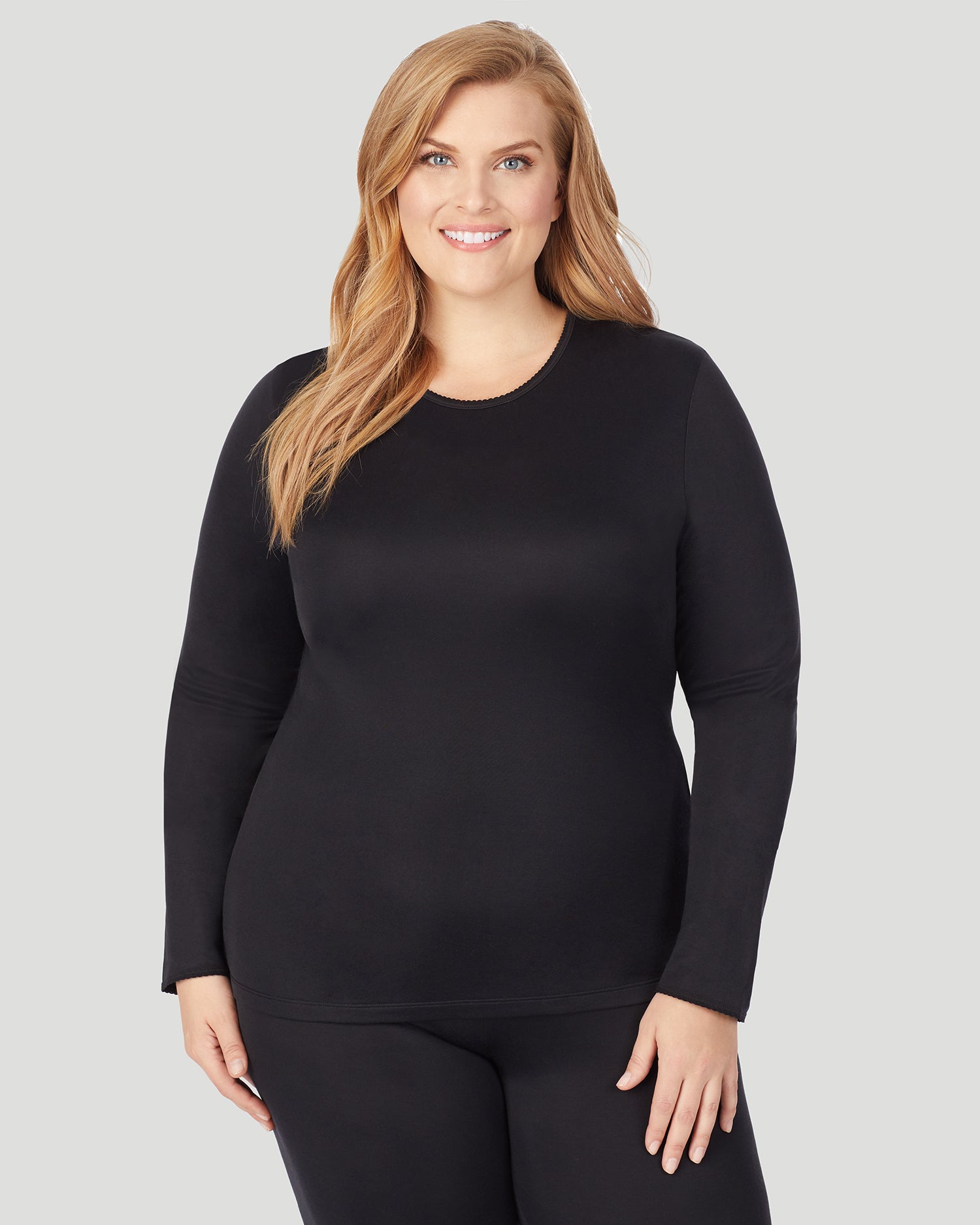 A lady wearing Softwear Long Sleeve Crew PLUS in Black  