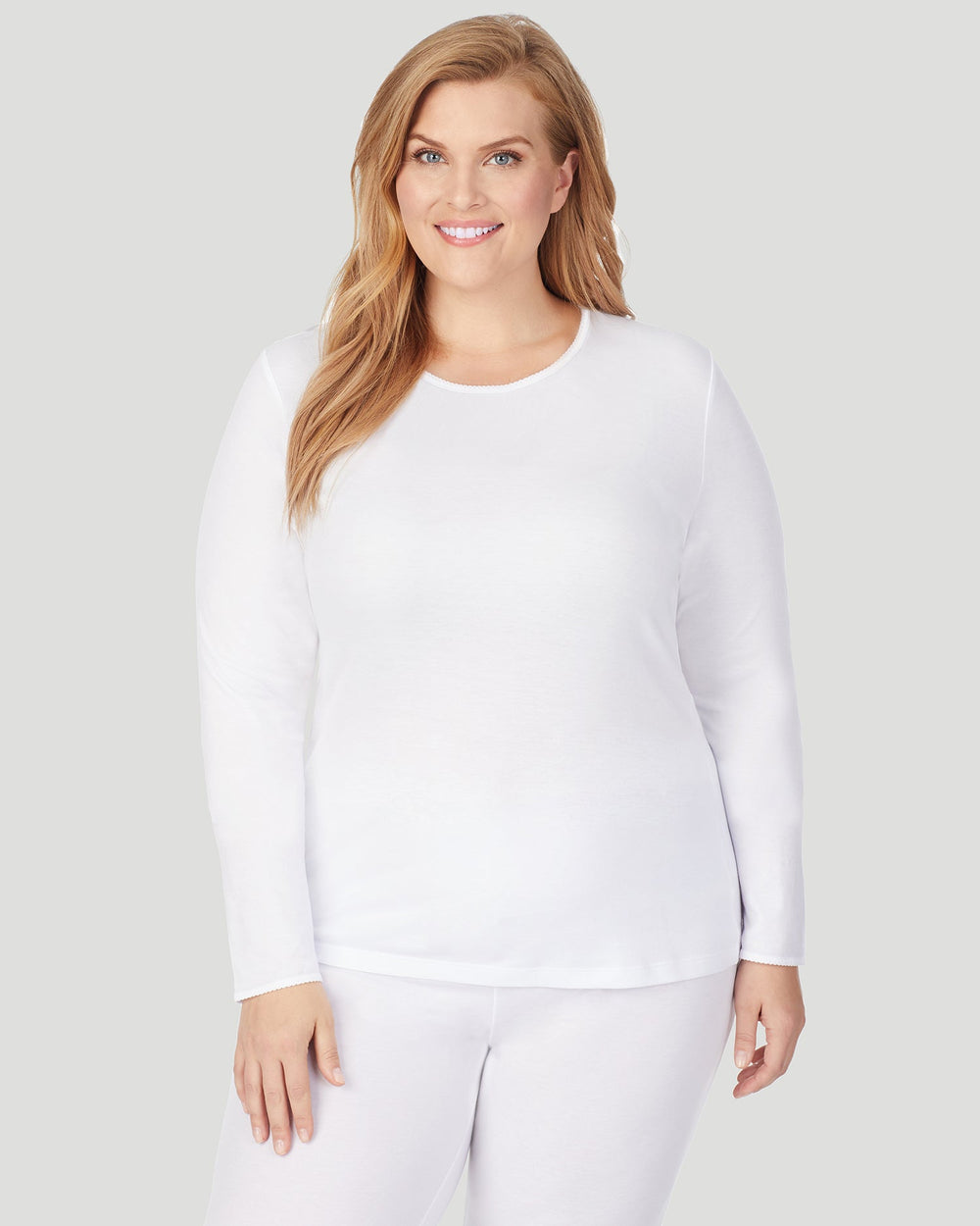 A lady wearing Softwear Long Sleeve Crew PLUS in White