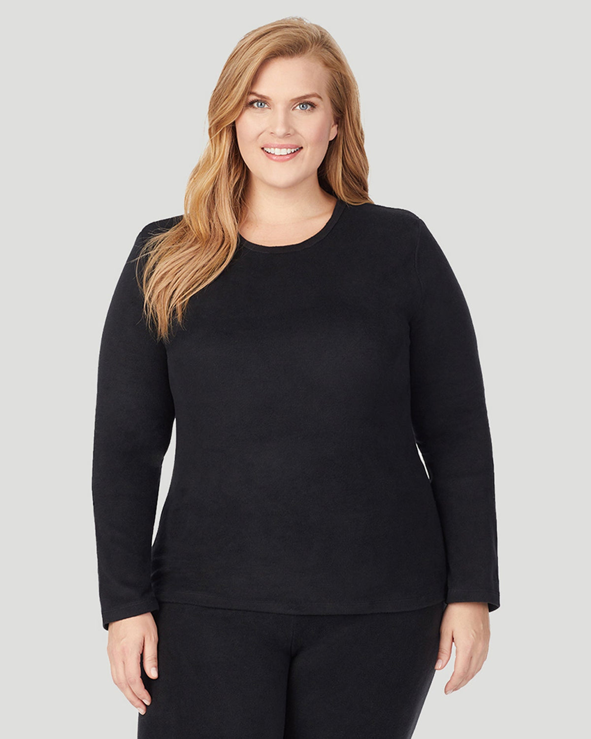 A lady wearing Fleecewear With Stretch Long Sleeve Crew PLUS in Black  