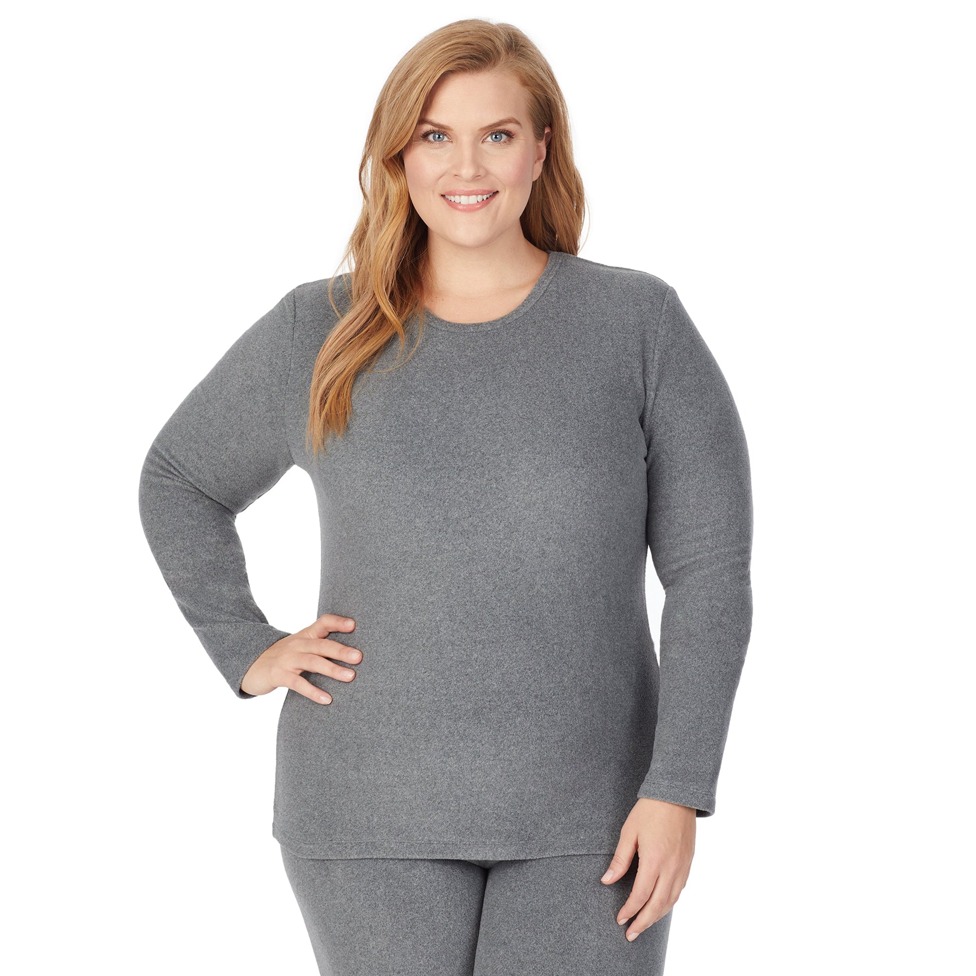 Upper body of a lady wearing grey long sleeve crew