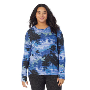 A lady wearing a Misty Forest long sleeve crew plus.