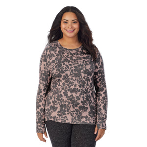 A lady wearing a Mauve Floral long sleeve crew plus.