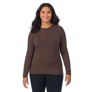 A lady wearing a pecan stripe long sleeve crew plus.