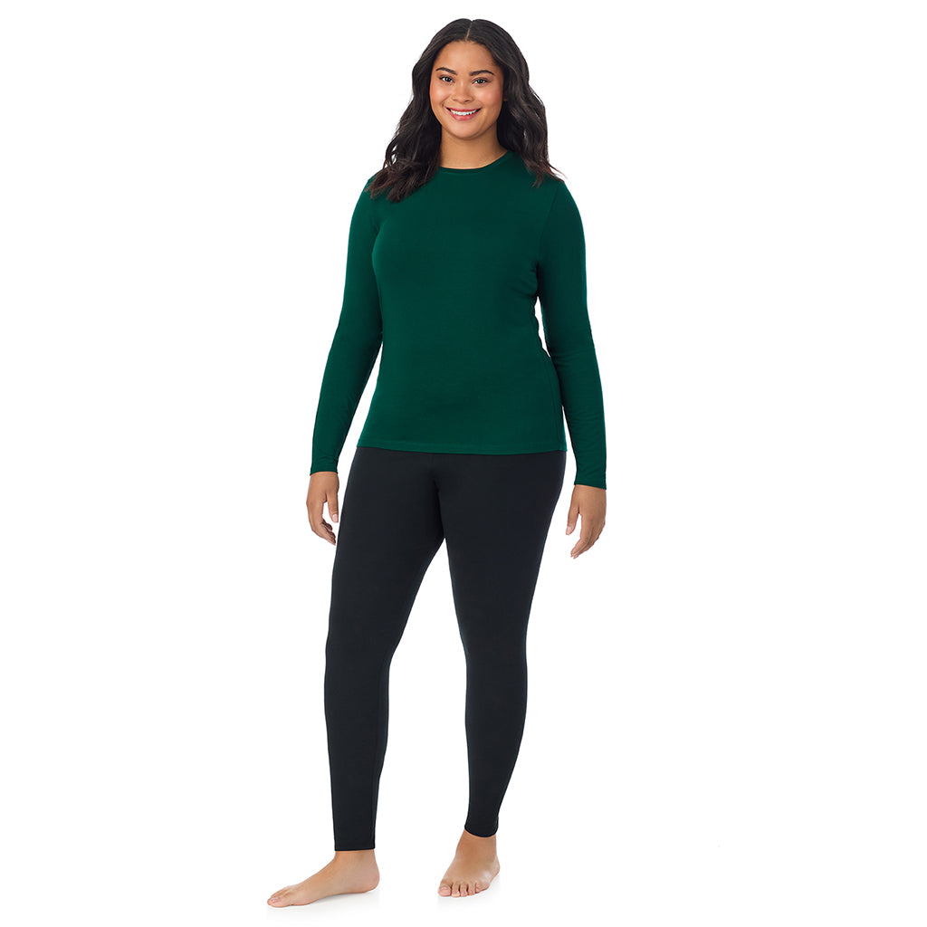 A lady wearing a evergreen long sleeve crew plus.