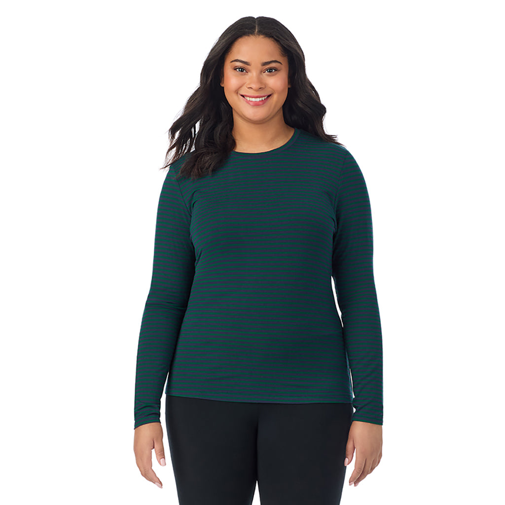 A lady wearing a navy green stripe long sleeve crew plus.