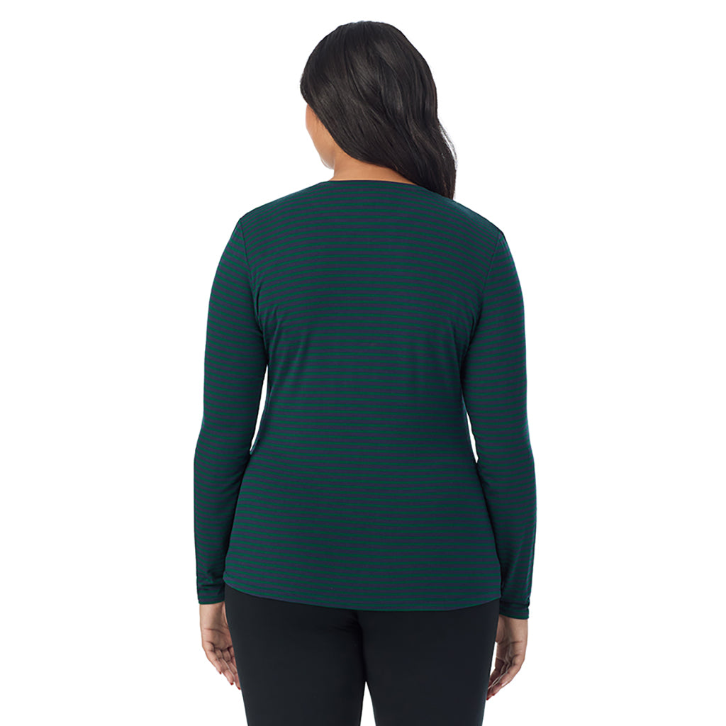 A lady wearing a navy green stripe long sleeve crew plus.