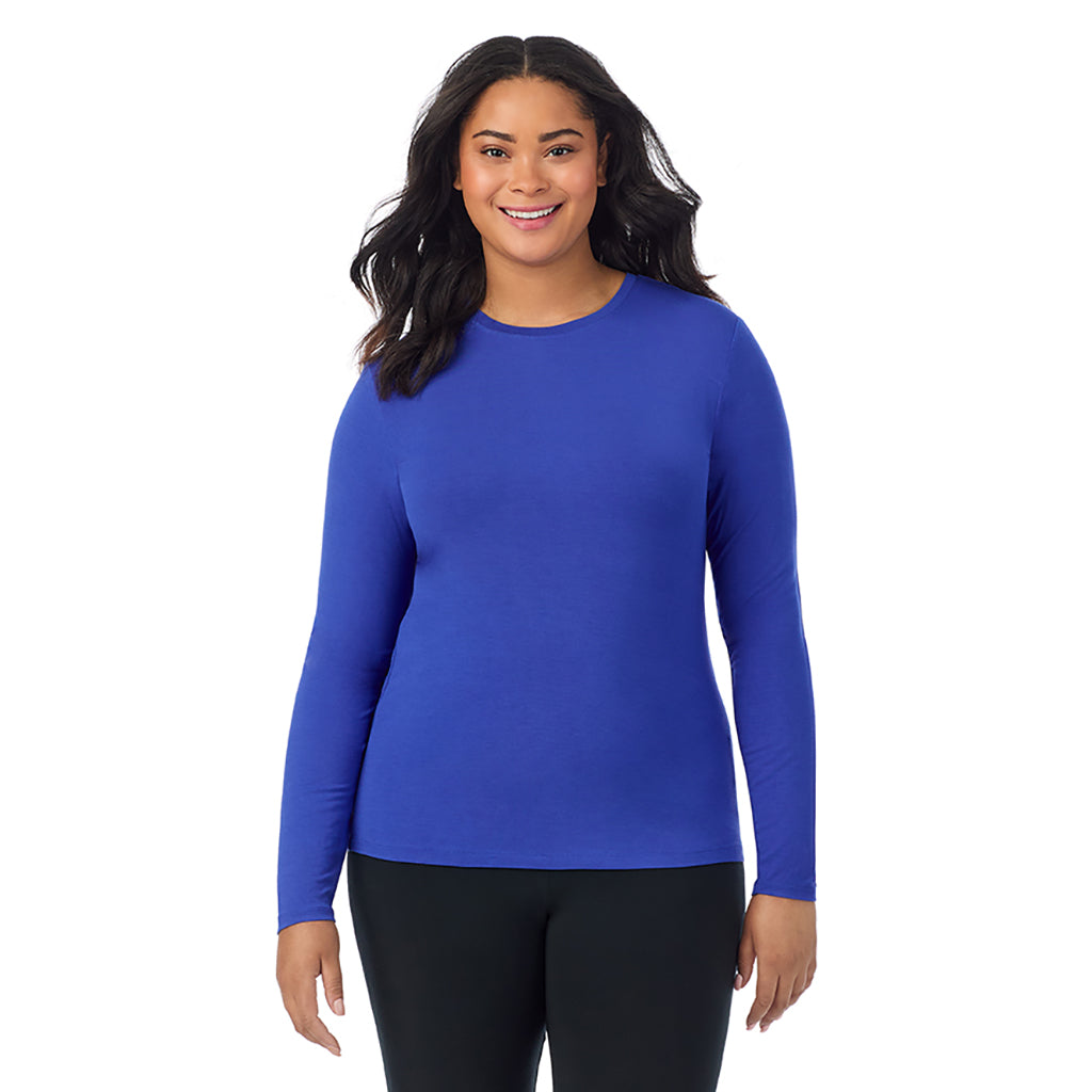 A lady wearing a dazzling blue long sleeve crew plus.