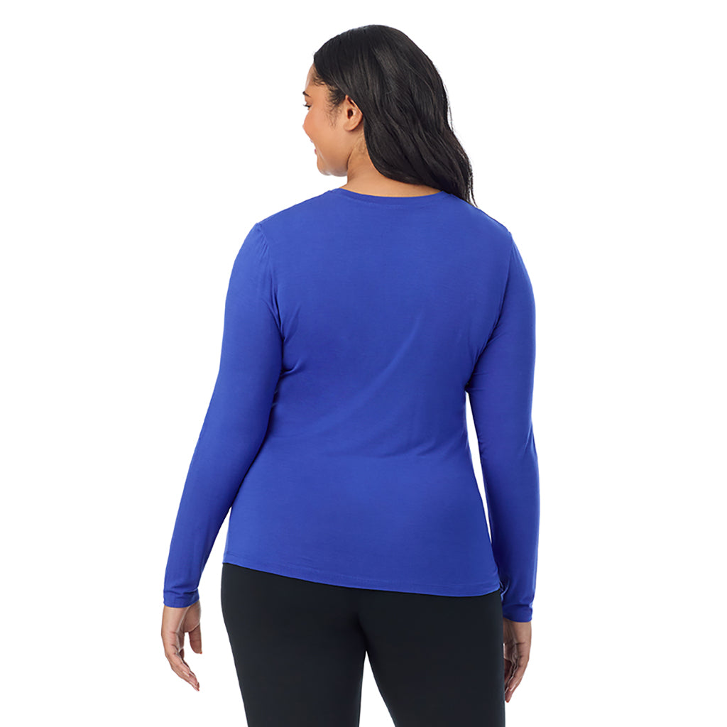 Dazzling Blue; Model is wearing size 1X. She is 5'11", Bust 36", Waist 36.5", Hips 47.5". @A lady wearing a dazzling blue long sleeve crew plus.