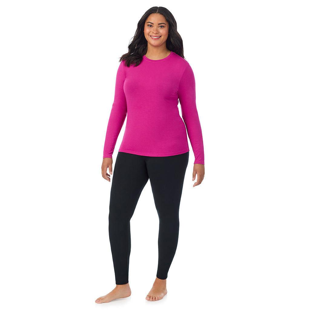 A lady wearing a deep fuschia long sleeve crew plus.