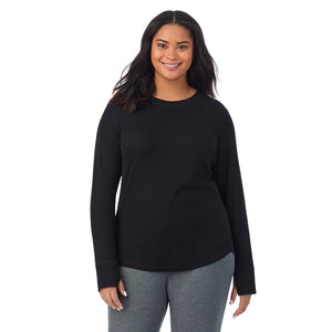 A lady wearing Cozy Stretch Thermal Long Sleeve Crew PLUS in Black  