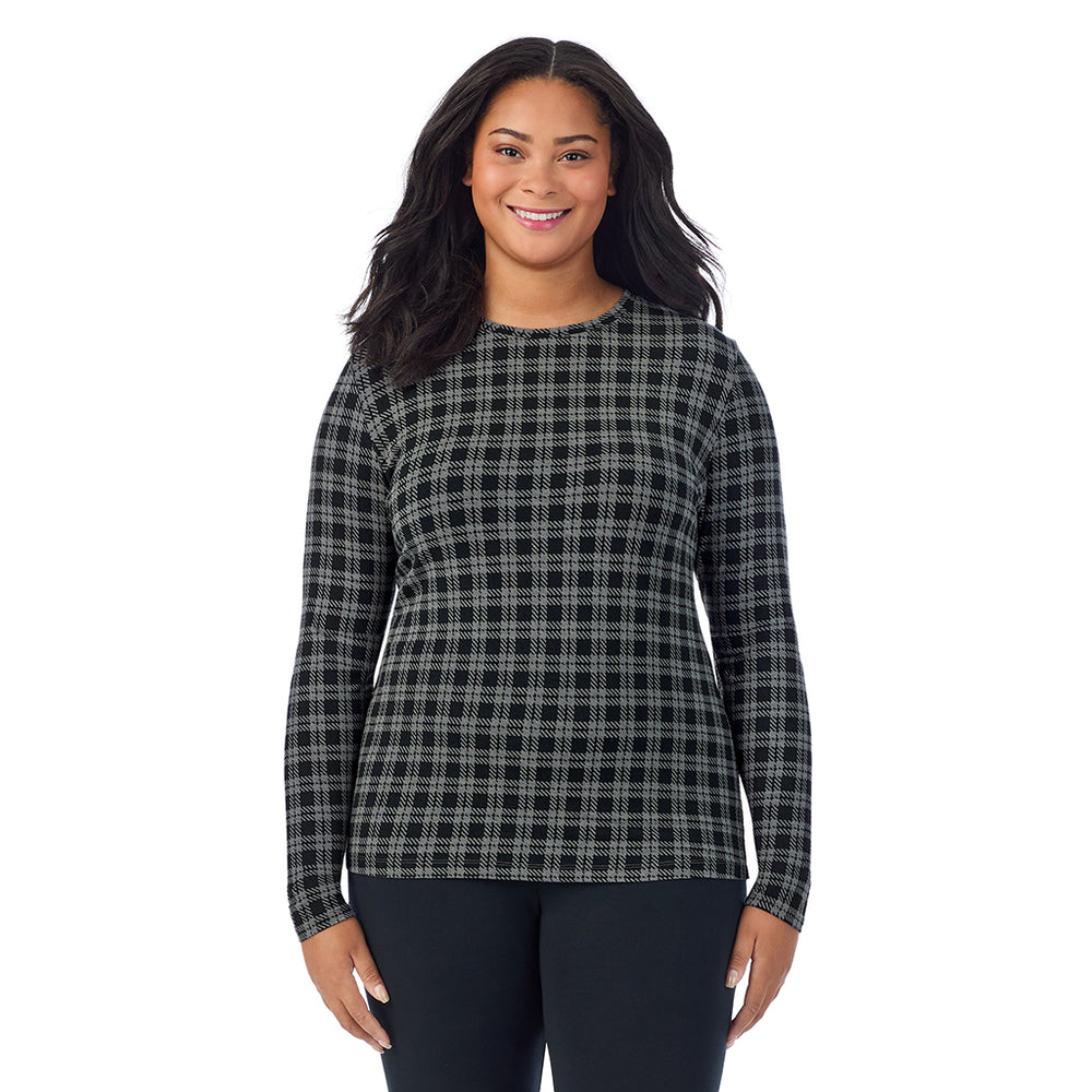 A lady wearing a charcoal/black plaid long sleeve crew plus.
