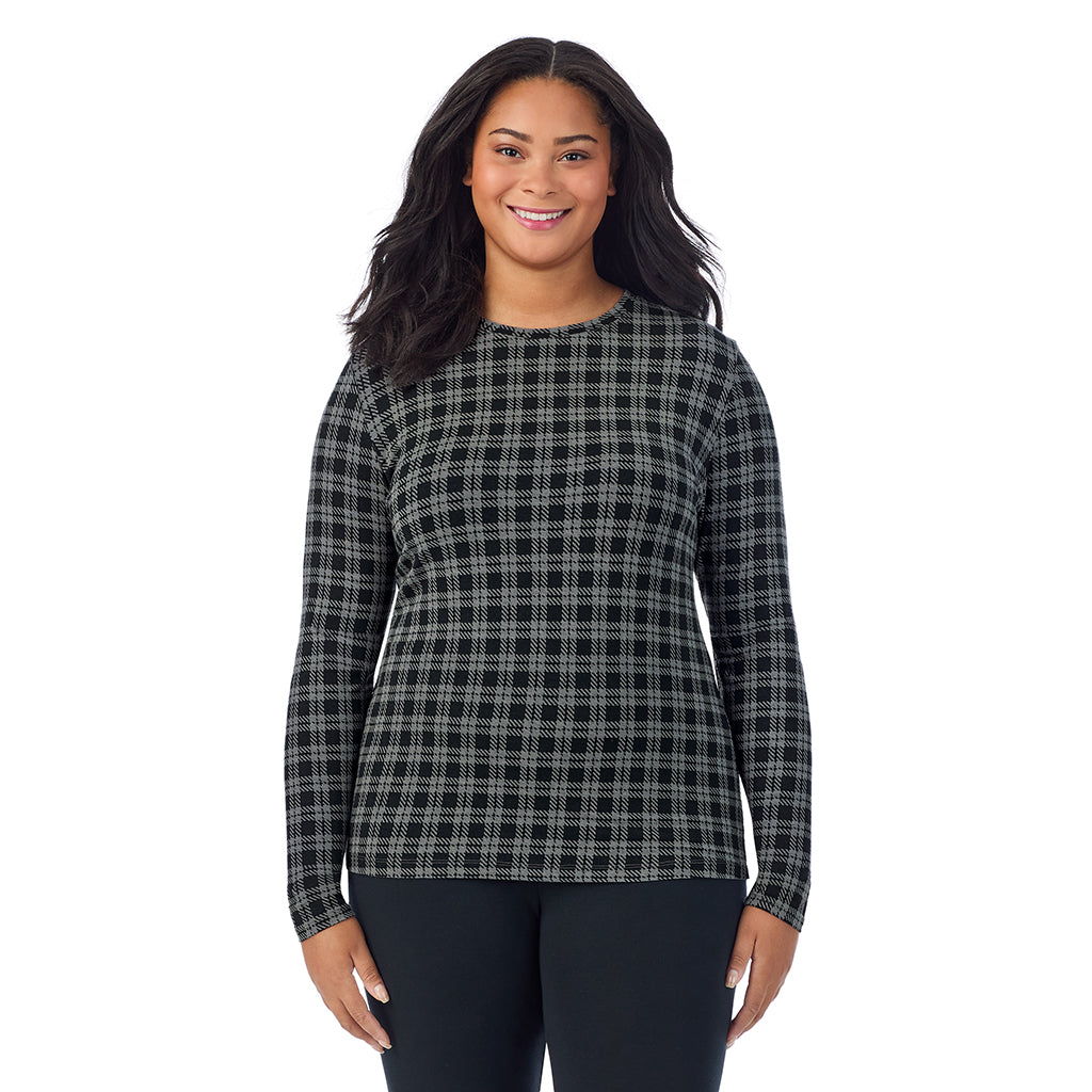 A lady wearing a charcoal/black plaid long sleeve crew plus.
