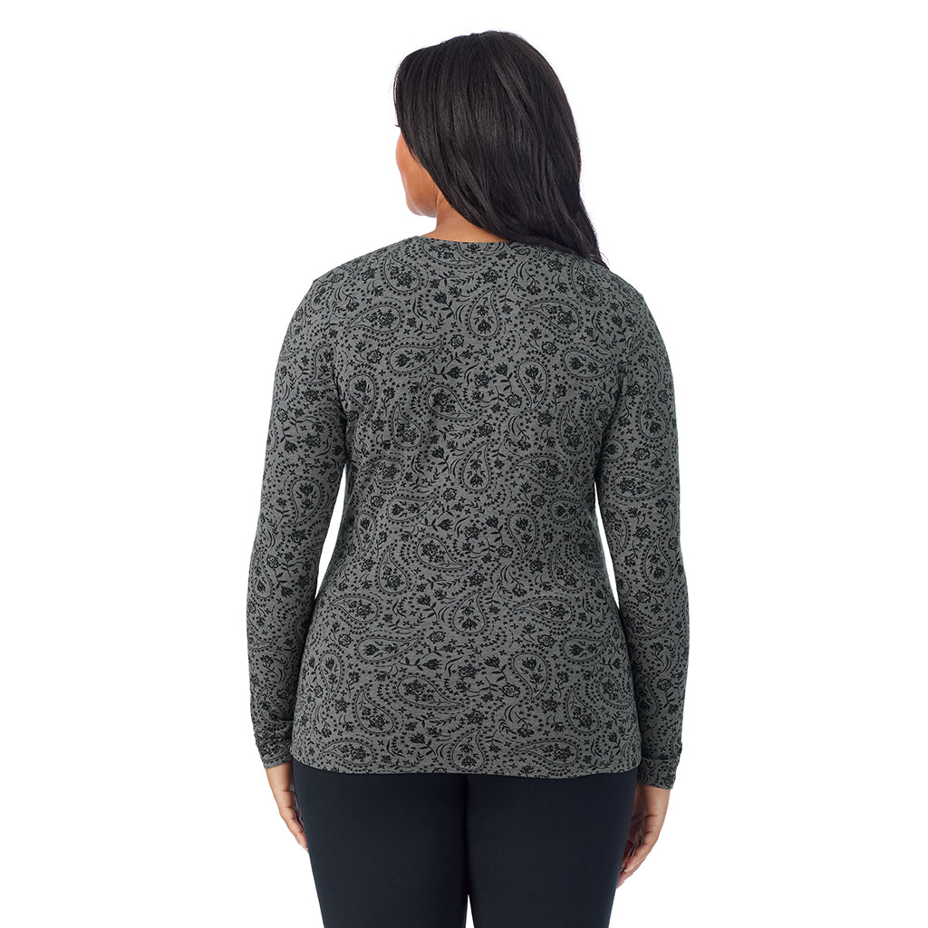 A lady wearing a charcoal paisley long sleeve crew plus.