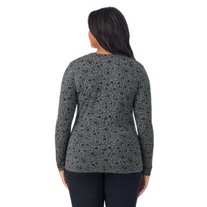 A lady wearing a charcoal paisley long sleeve crew plus.